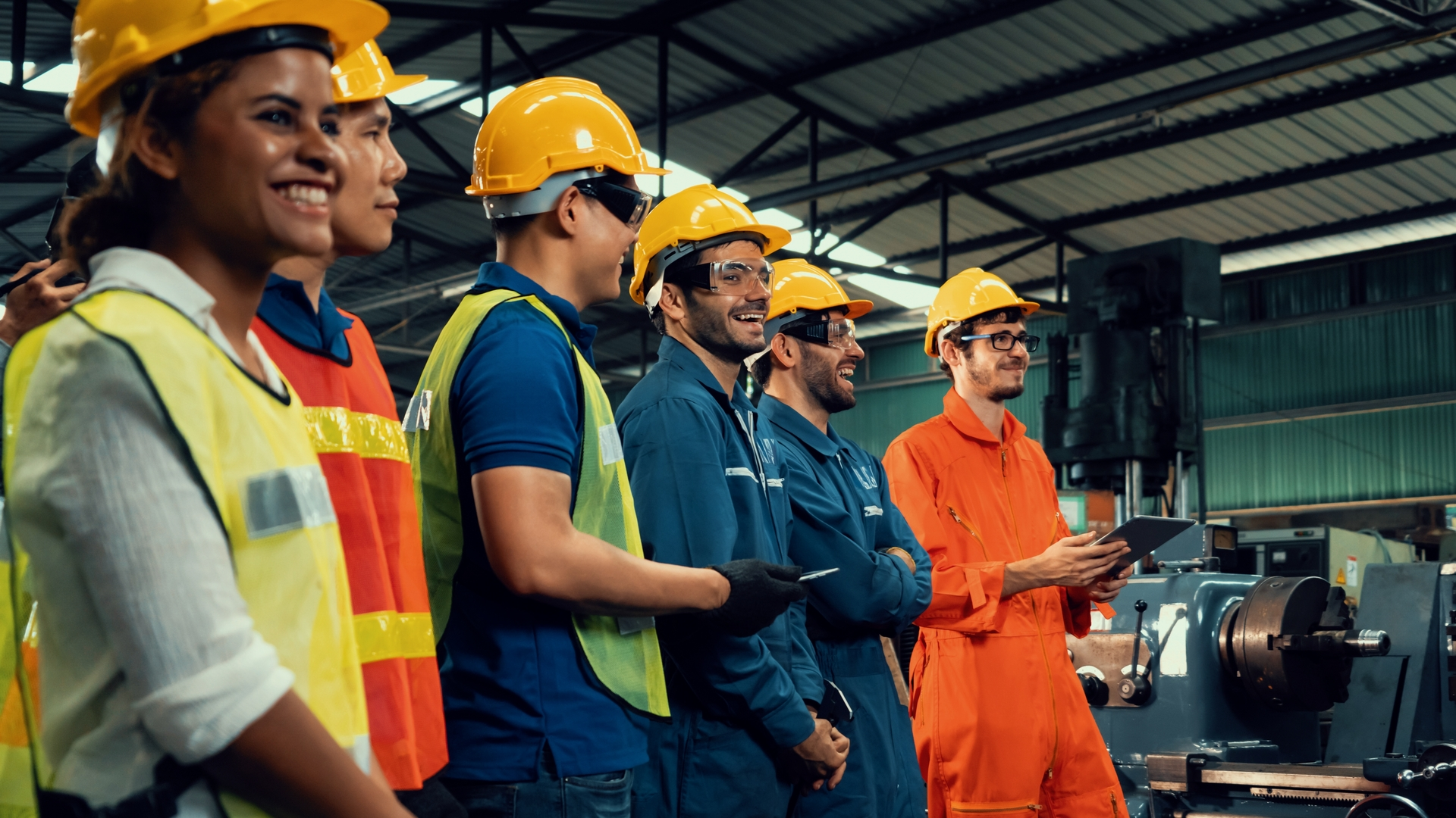 Factory employees having a conversation