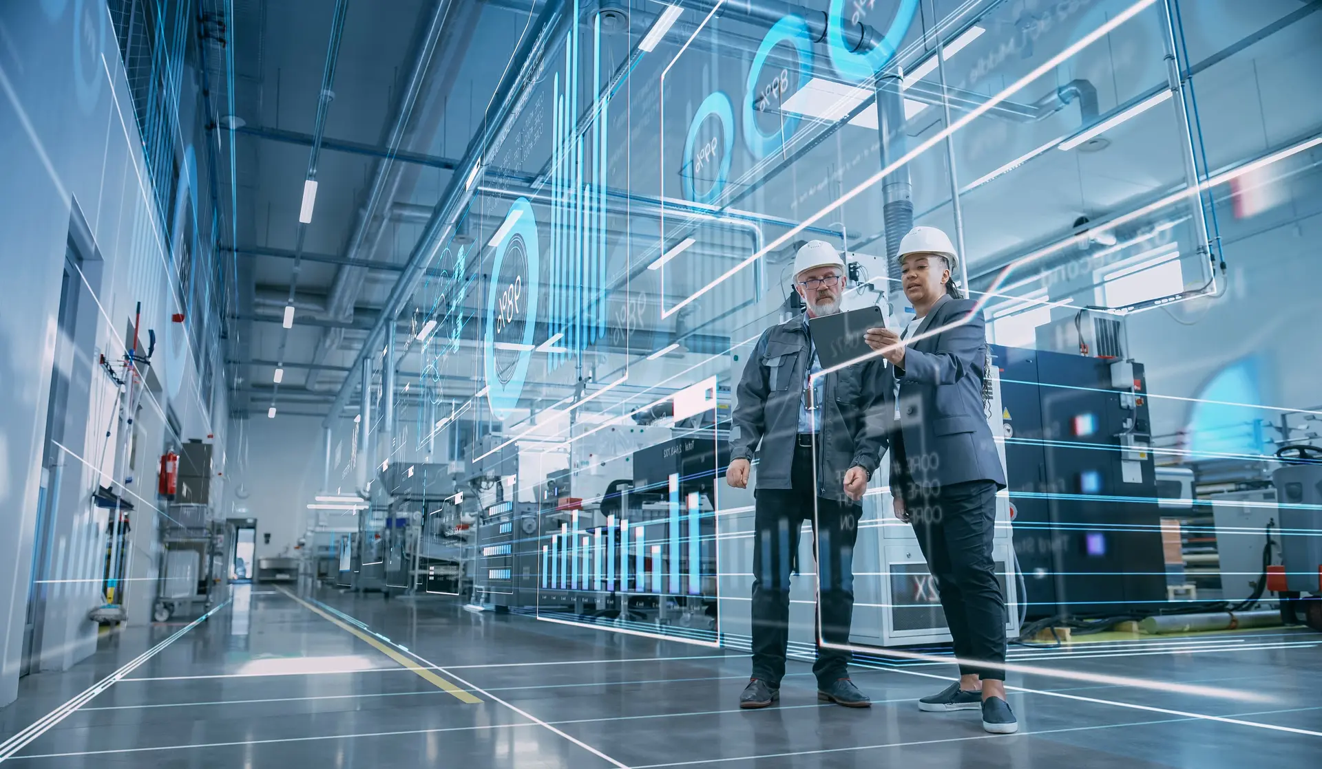 Two factory employees discussing plans